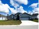 Curb appeal abounds in this charming new construction home! at 13447 Newport Shores Dr, Hudson, FL 34669