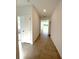 Bright and spacious hallway with tile flooring at 13447 Newport Shores Dr, Hudson, FL 34669