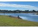 Scenic view of lake and houses from a lot at 13447 Newport Shores Dr, Hudson, FL 34669