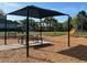 Covered picnic table near playground equipment at 13447 Newport Shores Dr, Hudson, FL 34669