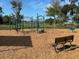 Modern playground with climbing equipment and bench at 13447 Newport Shores Dr, Hudson, FL 34669