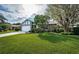 Single-story home with stone facade, attached garage, and well-manicured lawn at 3631 Player Dr, New Port Richey, FL 34655