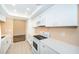 Updated kitchen featuring white cabinetry and quartz countertops at 3631 Player Dr, New Port Richey, FL 34655