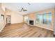 Living room features vaulted ceilings, a fireplace, and laminate wood flooring at 3631 Player Dr, New Port Richey, FL 34655