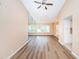 Open living room with large windows and laminate flooring at 3631 Player Dr, New Port Richey, FL 34655