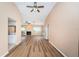 Large living room with high ceilings, wood-look floors, and multiple ceiling fans at 3631 Player Dr, New Port Richey, FL 34655