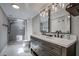 Modern bathroom with double vanity and walk-in shower at 3912 W San Pedro St, Tampa, FL 33629