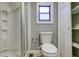 Clean bathroom with shower, toilet and built-in shelving at 3912 W San Pedro St, Tampa, FL 33629