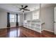 Bright bedroom with hardwood floors, built-in shelves and ceiling fan at 3912 W San Pedro St, Tampa, FL 33629