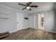 Well-lit bedroom featuring wood-look floors, double closets, and bathroom access at 3912 W San Pedro St, Tampa, FL 33629