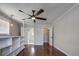 Bright bedroom with hardwood floors, built-in shelves and ceiling fan at 3912 W San Pedro St, Tampa, FL 33629