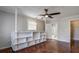 Bright bedroom with hardwood floors, built-in shelves and ceiling fan at 3912 W San Pedro St, Tampa, FL 33629