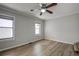 Bright bedroom with wood-look floors, ceiling fan, and ample natural light at 3912 W San Pedro St, Tampa, FL 33629