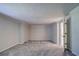 Large bedroom with grey carpet and an adjacent bathroom at 3912 W San Pedro St, Tampa, FL 33629