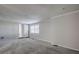 Spacious bedroom with grey carpet and access to bathroom at 3912 W San Pedro St, Tampa, FL 33629