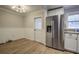 Bright dining area with hardwood floors and a white door at 3912 W San Pedro St, Tampa, FL 33629