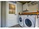 Laundry room with washer, dryer, and ample storage at 3912 W San Pedro St, Tampa, FL 33629