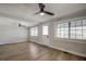 Light-filled living room with hardwood floors and ceiling fan at 3912 W San Pedro St, Tampa, FL 33629