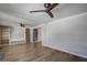 Living room with hardwood floors, built-ins, and ceiling fan at 3912 W San Pedro St, Tampa, FL 33629