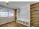 Built-in shelves and hardwood floors feature in this home office at 3912 W San Pedro St, Tampa, FL 33629