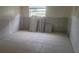 Unfinished bedroom with new tile floor and drywall at 5521 Bay Blvd # 101, Port Richey, FL 34668