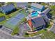 Aerial view of community tennis court and pool at 6704 Hickorywood Ln # 2B, New Port Richey, FL 34653