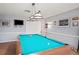 Game room featuring a billiard table and flat screen TV at 6704 Hickorywood Ln # 2B, New Port Richey, FL 34653