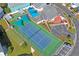 Aerial view of community pool and tennis court at 6704 Hickorywood Ln # 2B, New Port Richey, FL 34653