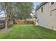 Landscaped backyard with putting green and wood fence at 804 S Fremont Ave, Tampa, FL 33606