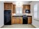 Modern basement kitchenette with wood cabinets and granite countertops at 804 S Fremont Ave, Tampa, FL 33606