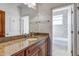 Bathroom with granite countertop, single sink vanity and shower/tub combo at 804 S Fremont Ave, Tampa, FL 33606