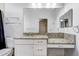 Bathroom with granite countertop, double sink vanity and large mirror at 804 S Fremont Ave, Tampa, FL 33606