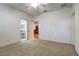 Bright bedroom with ceiling fan and neutral carpeting at 804 S Fremont Ave, Tampa, FL 33606