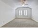 Spacious bedroom with ceiling fan and neutral carpeting at 804 S Fremont Ave, Tampa, FL 33606