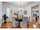 Elegant dining room with hardwood floors, chandelier and large clock at 804 S Fremont Ave, Tampa, FL 33606