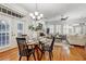 Bright dining room with glass table and hardwood floors at 804 S Fremont Ave, Tampa, FL 33606