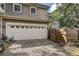 Two-car garage with white door and decorative windows at 804 S Fremont Ave, Tampa, FL 33606