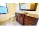 Updated bathroom with granite countertop and dark wood vanity at 6206 Soaring Ave, Temple Terrace, FL 33617