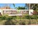 Welcoming Raintree Oaks deed restricted community sign surrounded by lush landscaping at 6206 Soaring Ave, Temple Terrace, FL 33617