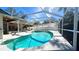 Inviting pool and spa with screened enclosure at 6206 Soaring Ave, Temple Terrace, FL 33617