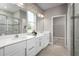 Bathroom with double vanity, large mirror and walk-in shower at 10005 Zennia Ln, Parrish, FL 34219