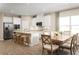 Open concept kitchen with white cabinets and an island at 10005 Zennia Ln, Parrish, FL 34219