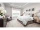 Main bedroom with large window, luxurious bed, and water view at 10005 Zennia Ln, Parrish, FL 34219