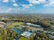 Community overview featuring tennis courts, pool, and local shops at 1931 Sassafras Dr, Wesley Chapel, FL 33543