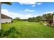 Spacious backyard with pond view and lush lawn at 1931 Sassafras Dr, Wesley Chapel, FL 33543
