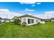Well-maintained exterior with a large grassy area at 1931 Sassafras Dr, Wesley Chapel, FL 33543