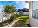 Backyard with stone path leading to shed at 12528 Roseland Dr, New Port Richey, FL 34654