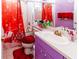 Clean bathroom with red accents and shower/tub combo at 12528 Roseland Dr, New Port Richey, FL 34654