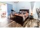 Bedroom with king-size bed and access to backyard at 12528 Roseland Dr, New Port Richey, FL 34654