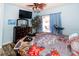 Bedroom with king-size bed, dresser, and access to patio at 12528 Roseland Dr, New Port Richey, FL 34654